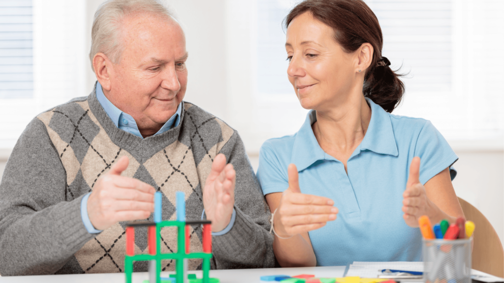An OT assisting a senior citizen in Cognitive rehabilitation
